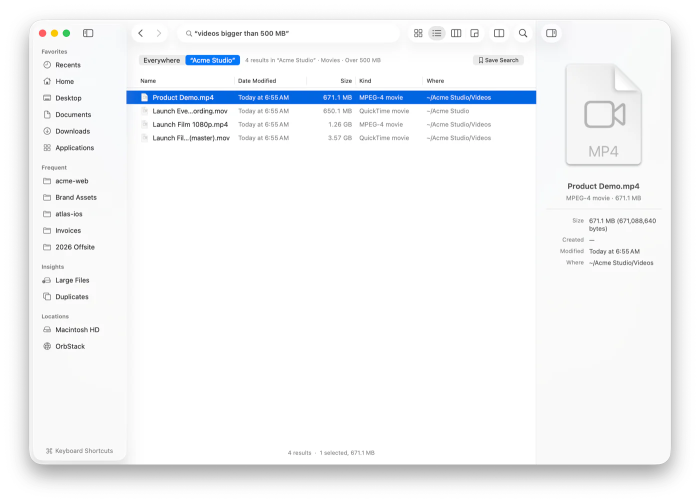 A plain-English search for videos bigger than 500 MB, with the results and how Strata read the query